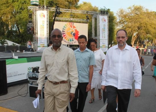 At left, Mr. Leonard Robertson, Adviser, Communications Unit, CARICOM Secretariat and Ambassador Irwin LaRocque (right), CARICOM Secretary-General, on their way to the opening of CARIFESTA XI, Independence Square, Paramaribo, Suriname, 16 August 2013