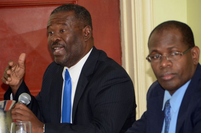 Programme Manager, Caricom Single Market and Economy, CARICOM Secretariat, Ivor Carryl (left), addresses members of the public sector during a two-day forum to discuss the findings of a major consultancy on government procurement in the CARICOM Singl