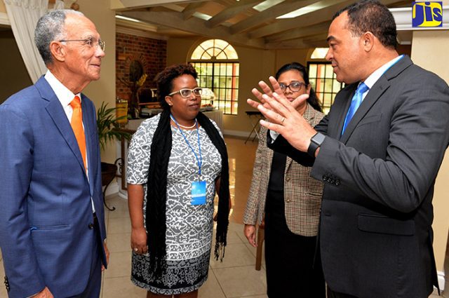 Minister of Health, Dr. the Hon. Christopher Tufton (right), speaks with (from left): President, Healthy Caribbean Coalition, Sir Trevor Hassell; Director, Non-Communicable Diseases and Injury Prevention, Ministry of Health, Dr. Tamu Davidson; and Ac
