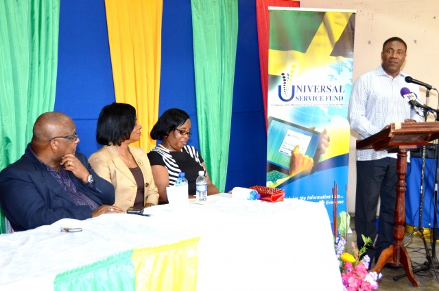 Jamaica’s Minister of Science, Technology, Energy & Mining, Hon. Phillip Paulwell (right), addresses the opening of an Internet Café and Information and Communication Technology (ICT) Centre at the Farm Primary and Junior High School