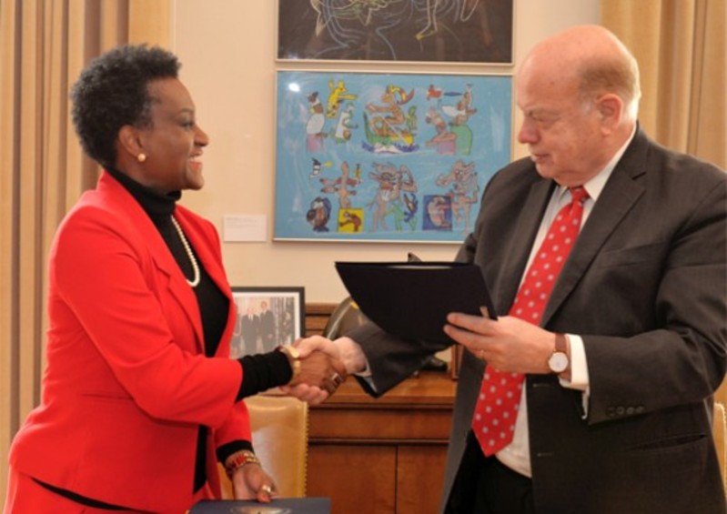 OAS Secretary General His Excellency Jose Miguel Insulza (right)  and St Kitts and Nevis&rsquo; Permanent Representative to the OAS, Her Excellency Jacinth Lorna Henry-Martin