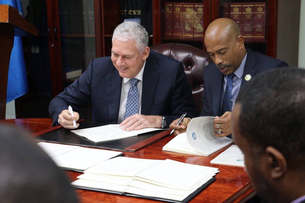 Saint Lucia Prime Minister, the Hon. Allen Chastanet and CDF Chief Executive Officer, Mr. Rodinald Soomer sign the agreement