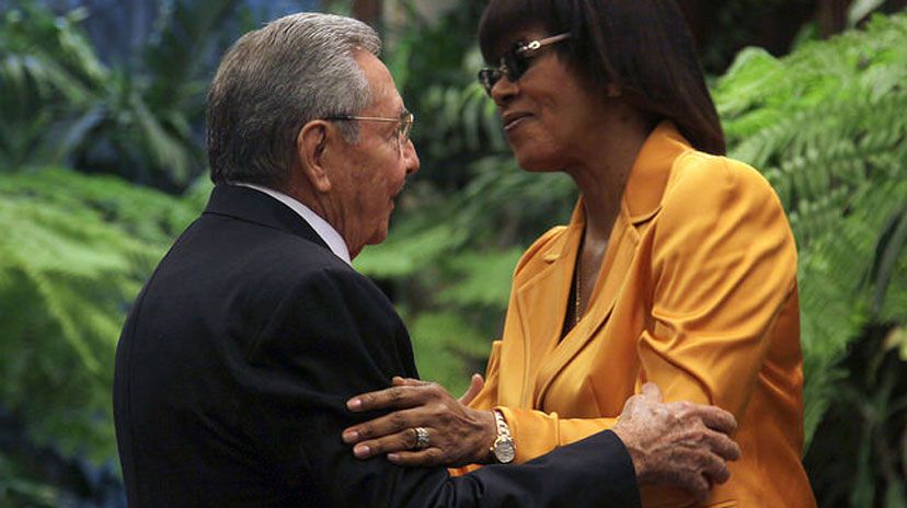 Prime Minister Portia Simpson-Miller is greeted by President Raul Castro in Havana