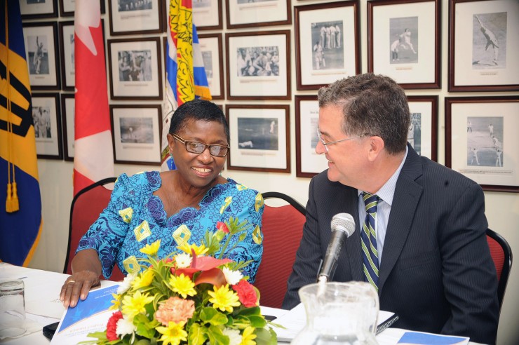 Prof Velma Newton, Regional Project Director Impact Justice(left) and Richard Hanley, Canadian High Commissioner (right) in discussion prior to launch of Impact Justice