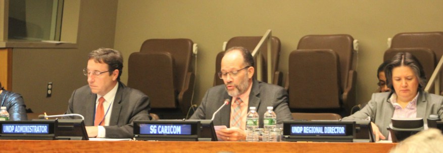 CARICOM Secretary General Ambassador Irwin LaRocque presenting remarks. Also at the Head Table are UNDP Administrator Mr Achim Steiner (l) and Director of UNDP&rsquo;s Regional Bureau for Latin America and the Caribbean Ms Jessica Faieta.