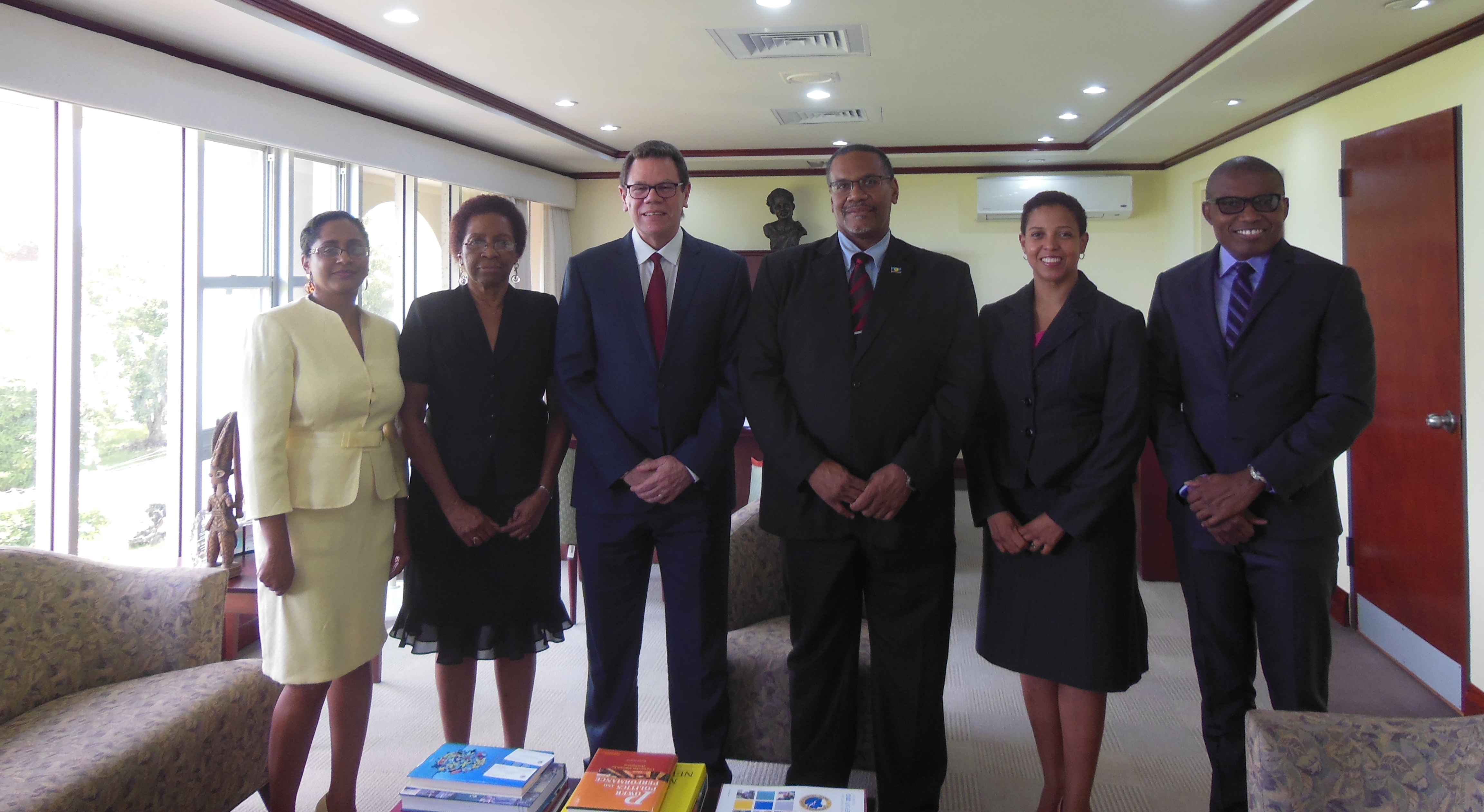 ASG Cox (3rd from right) paid a courtesy call on the President of the Caribbean Development Bank (CDB), Mr. Warren Smith (3rd from left). Others in the photo (from left) Lilia Ramjeawan, Special Assistant to the ASG-TEI; Desiree Field-Ridley, Advisor