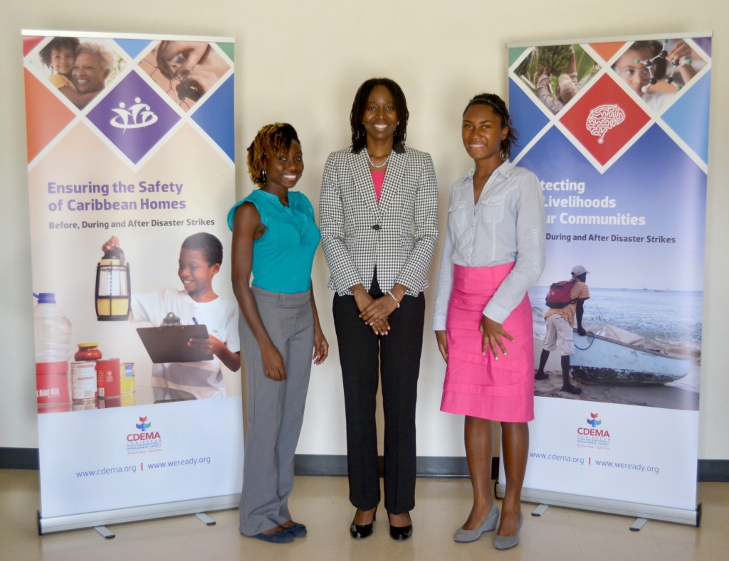 The Students, Ms Florence Fields (l) and Ms Emma Sealy (r) pose for a photograph with Ms Elizabeth Riley, Deputy Executive Director, CDEMA (Photo via CDEMA)