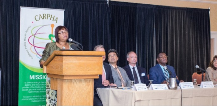 Dr. St. John addresses the opening ceremony of the workshop (Photograph via CARPHA )
