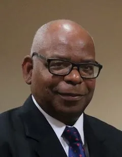 H.E. Mr. Lawrence Sylvester